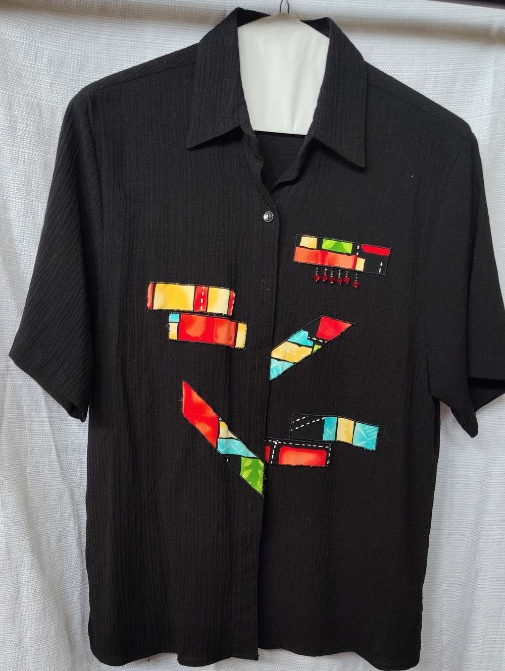 Black Short-Sleeve Women's Large Shirt with Colorful Patch Accents